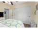 Bedroom with a large closet and a window providing natural light at 864 S 223Rd Ln, Buckeye, AZ 85326