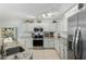Bright kitchen with ample cabinetry, granite countertops, stainless steel appliances, and recessed lighting at 864 S 223Rd Ln, Buckeye, AZ 85326
