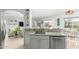 Kitchen showcasing granite countertops, stainless steel appliances, and an open view into the living spaces at 864 S 223Rd Ln, Buckeye, AZ 85326