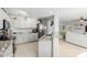 Well-lit kitchen with stainless steel appliances, granite countertops, and seamless flow into the living area at 864 S 223Rd Ln, Buckeye, AZ 85326