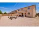 Large backyard features low maintenance landscaping, comfortable outdoor seating and covered patio at 868 W Desert Glen Dr, San Tan Valley, AZ 85143