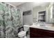 Stylish bathroom featuring a patterned shower curtain and a vanity with ample counter space at 868 W Desert Glen Dr, San Tan Valley, AZ 85143