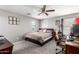 Bright bedroom with neutral colors, ceiling fan, and a comfortable bed at 868 W Desert Glen Dr, San Tan Valley, AZ 85143