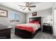 This bedroom features a ceiling fan, neutral-toned paint, and coordinated linens at 868 W Desert Glen Dr, San Tan Valley, AZ 85143