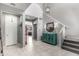 Inviting foyer with decorative console table, tiled floors, and staircase to the upper level at 868 W Desert Glen Dr, San Tan Valley, AZ 85143
