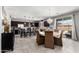Open-concept kitchen and dining area with large island and ample seating and a sliding door to the back yard at 868 W Desert Glen Dr, San Tan Valley, AZ 85143