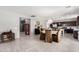 Open-concept kitchen and dining area boasts tiled floors and stylish light fixture at 868 W Desert Glen Dr, San Tan Valley, AZ 85143