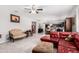 Open-concept living room with tile floors, neutral paint, and views to the kitchen at 868 W Desert Glen Dr, San Tan Valley, AZ 85143