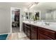 Bright main bathroom with double sink vanity and a walk-in closet at 868 W Desert Glen Dr, San Tan Valley, AZ 85143