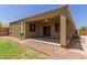 This backyard features a covered patio, landscaping and great views at 871 E Melanie St, San Tan Valley, AZ 85140