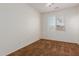Well-lit bedroom featuring carpet flooring and neutral walls with a fan at 871 E Melanie St, San Tan Valley, AZ 85140