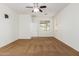 Spacious bedroom with neutral color palette, ceiling fan, and ample natural light at 871 E Melanie St, San Tan Valley, AZ 85140