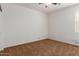 This bedroom is a blank canvas ready for your personal touch; featuring neutral walls and brown carpet at 871 E Melanie St, San Tan Valley, AZ 85140