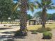 Community park with picnic pavilion, sport court and palm trees located along a landscaped walking path at 871 E Melanie St, San Tan Valley, AZ 85140