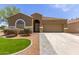 Charming home featuring desert landscaping, paver driveway, and a neutral color palette at 871 E Melanie St, San Tan Valley, AZ 85140