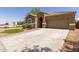 Charming home featuring desert landscaping, paver driveway, and a neutral color palette at 871 E Melanie St, San Tan Valley, AZ 85140