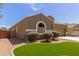 Attractive home with a well maintained artificial grass area and low maintenance desert landscaping at 871 E Melanie St, San Tan Valley, AZ 85140