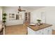 Beautiful kitchen view with island seating, stylish countertops, and easy access to living areas, perfect for entertaining at 871 E Melanie St, San Tan Valley, AZ 85140