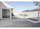 Backyard with concrete patio and low-maintenance gravel landscaping at 925 E Wagoner Rd, Phoenix, AZ 85022