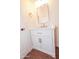 Modern bathroom vanity with white cabinets, gold hardware, marble countertop, and a rectangular mirror at 925 E Wagoner Rd, Phoenix, AZ 85022