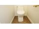 Bright bathroom featuring a white toilet and wood look floors at 925 E Wagoner Rd, Phoenix, AZ 85022