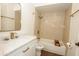 Bright bathroom featuring a vanity, shower/tub combo, and gold hardware at 925 E Wagoner Rd, Phoenix, AZ 85022