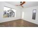 Bright bedroom with hardwood floors, neutral colors, and a large window at 925 E Wagoner Rd, Phoenix, AZ 85022