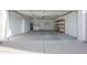 Open two car garage with storage cabinets, shelving, water heater, and laundry at 925 E Wagoner Rd, Phoenix, AZ 85022