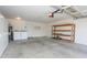 Interior of garage with storage shelves, utility equipment, and laundry at 925 E Wagoner Rd, Phoenix, AZ 85022