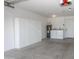 Spacious garage interior with storage cabinets, water heater, and laundry area at 925 E Wagoner Rd, Phoenix, AZ 85022