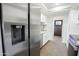 Contemporary kitchen with stainless steel refrigerator, white cabinets, and tiled backsplash at 925 E Wagoner Rd, Phoenix, AZ 85022