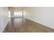 Open living room showcases wood-look tile floors, modern trim work, and a contemporary light fixture at 925 E Wagoner Rd, Phoenix, AZ 85022