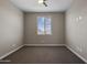 Neutral bedroom with a ceiling fan and a window with natural light at 10071 W Angels Ln, Peoria, AZ 85383