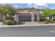 Beautiful home features a desert landscape, tile roof, paver driveway and spacious two car garage at 10071 W Angels Ln, Peoria, AZ 85383