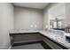 Dedicated office space includes granite countertop and built in features at 10071 W Angels Ln, Peoria, AZ 85383