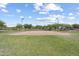 Community volleyball court on grass with trees and street lamps at 10071 W Angels Ln, Peoria, AZ 85383