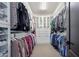 Organized walk-in closet offering ample hanging storage and built-in shelving for clothes and shoes at 10071 W Angels Ln, Peoria, AZ 85383