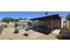 Fenced backyard features a pool, covered patio, and mature landscaping at 10408 W Devonshire Ave, Phoenix, AZ 85037