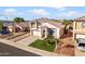 Aerial view of a well-maintained home featuring lush green grass, a tile roof and mature landscaping at 11056 W Lane Ave, Glendale, AZ 85307