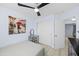 Well-lit bedroom with fan, closet and modern vanity, creating a cozy retreat at 11056 W Lane Ave, Glendale, AZ 85307