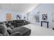 Airy living room featuring a vaulted ceiling, and a comfortable gray sectional couch at 11056 W Lane Ave, Glendale, AZ 85307