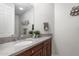 Well-lit bathroom with granite countertop, single sink, and stylish decor at 11400 E Helm Dr, Scottsdale, AZ 85255