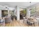 Open floor plan with dining area and access to the outdoor patio, perfect for entertaining at 11400 E Helm Dr, Scottsdale, AZ 85255