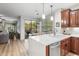Gourmet kitchen showcasing white countertops, and views of the breakfast nook and outdoor patio at 11400 E Helm Dr, Scottsdale, AZ 85255