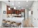 Modern kitchen featuring pendant lighting, stainless steel appliances, and a breakfast bar with seating at 11400 E Helm Dr, Scottsdale, AZ 85255