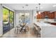 Open concept eat-in kitchen featuring a breakfast bar, sliding doors and views of the yard at 11400 E Helm Dr, Scottsdale, AZ 85255