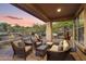 Covered outdoor patio featuring seating area with desert landscaping at 11400 E Helm Dr, Scottsdale, AZ 85255