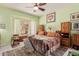 Inviting bedroom featuring a large bed, window seat and traditional decor at 115 E Spur Ave, Gilbert, AZ 85296