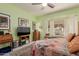 Relaxing bedroom featuring a large window, comfortable bed, and traditional décor at 115 E Spur Ave, Gilbert, AZ 85296