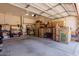 Spacious two-car garage, featuring storage, a workbench, and ample space for parking and projects at 115 E Spur Ave, Gilbert, AZ 85296